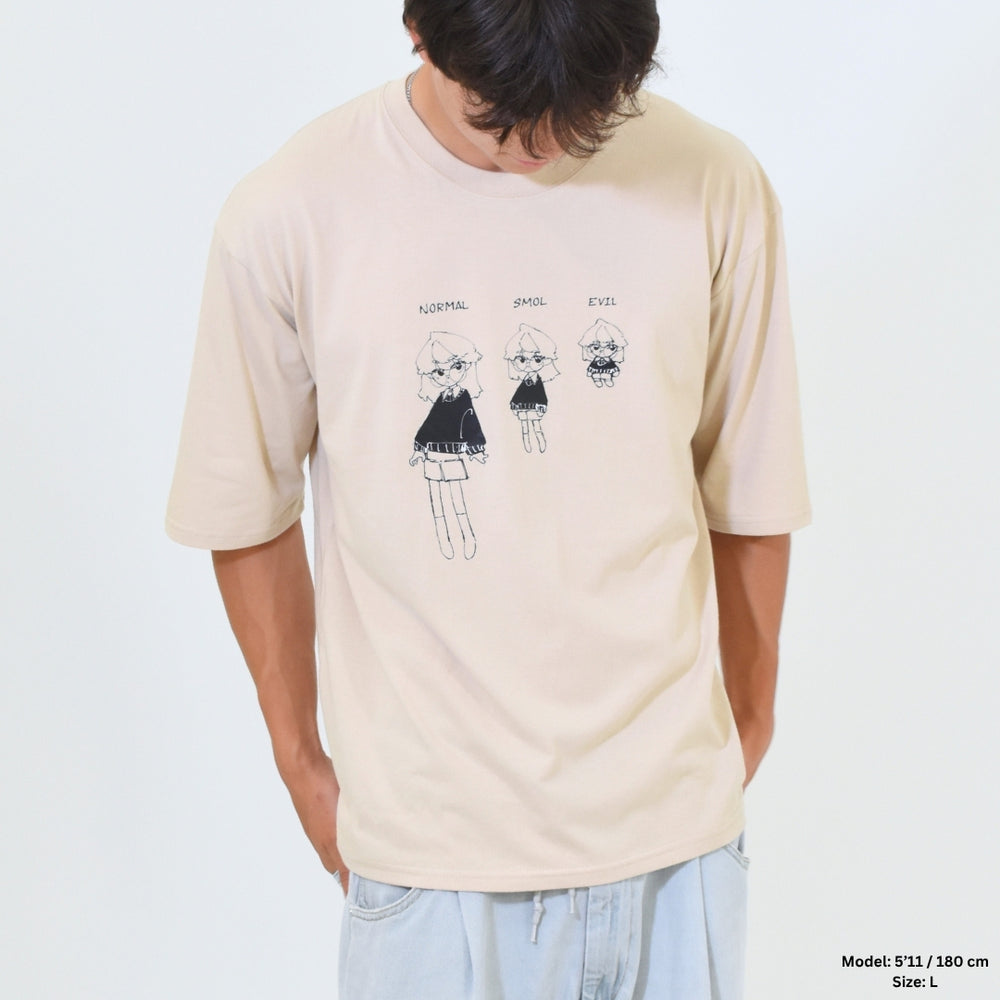 Person wearing a beige t-shirt with cartoon character design on a plain background