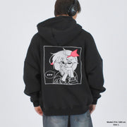 A person wearing a black hoodie with a graphic print of an anime character on the back.