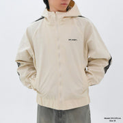 Beige jacket with black accents and 'Off-White' branding on a white background