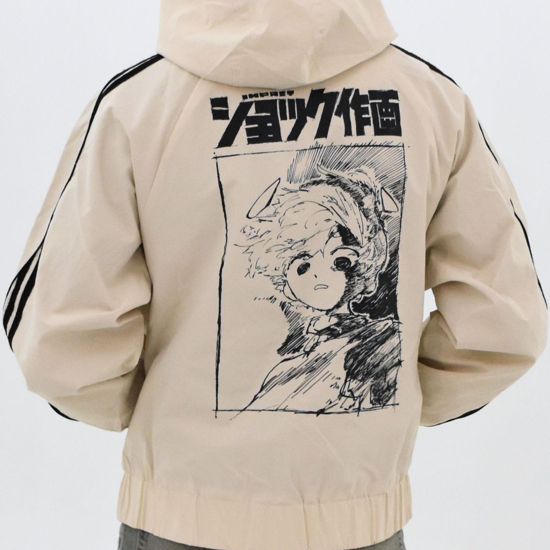 Beige hoodie with anime-style illustration on the back against a white background