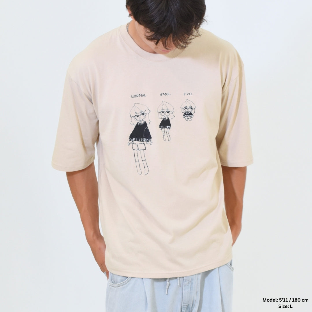 Person wearing a beige t-shirt with cartoon character design on a plain background