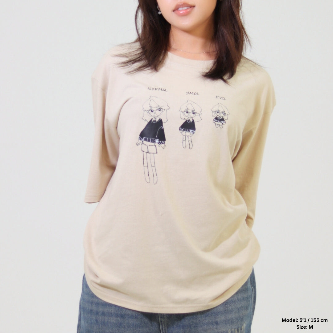 Beige sweatshirt with graphic design worn by a person on a plain background