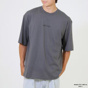 Person wearing a gray t-shirt with 'Lazy Cat' logo on a white background