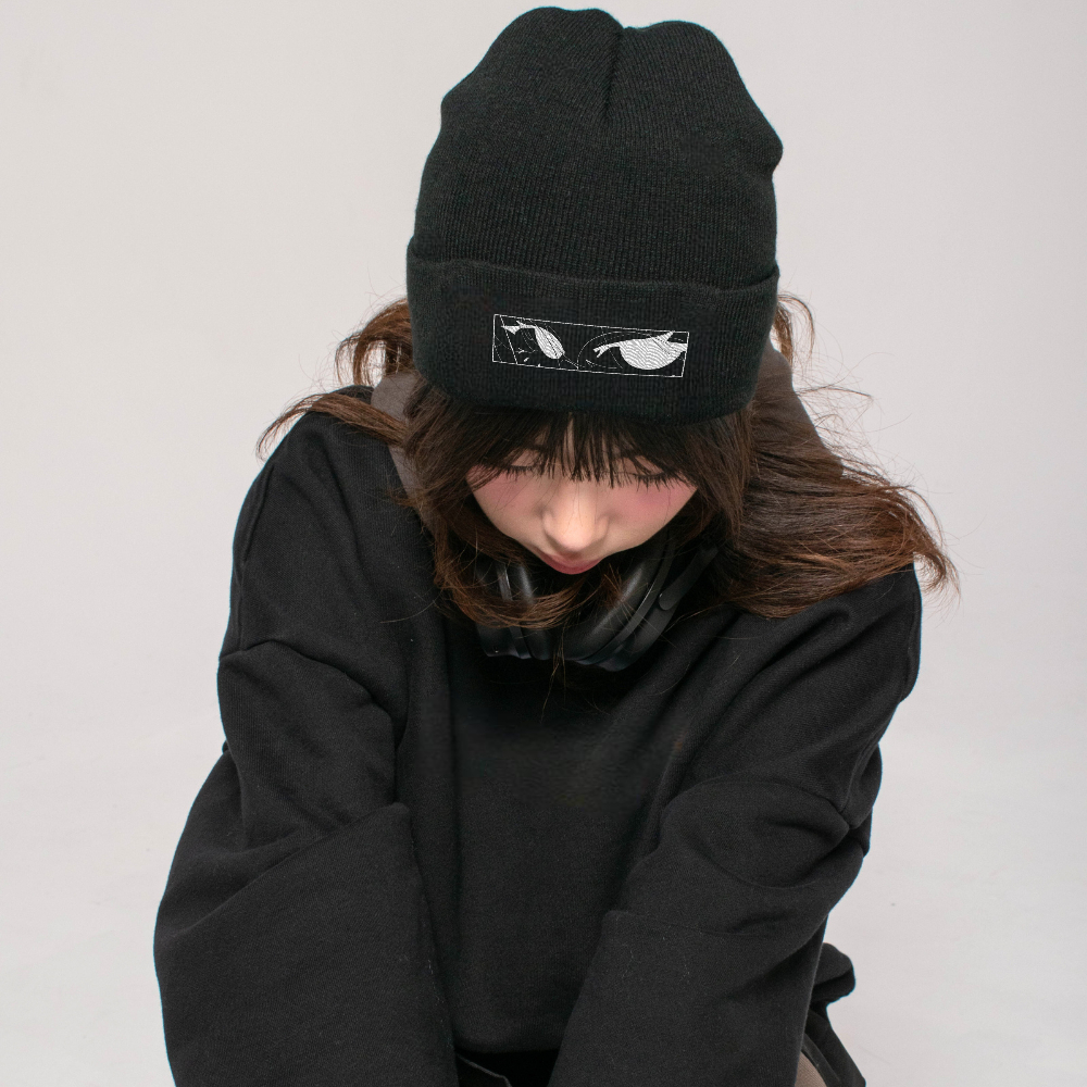female model with embroidered black beanie hat