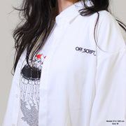 White shirt with graphic design and 'OFF SCRIPT' text worn by a person.