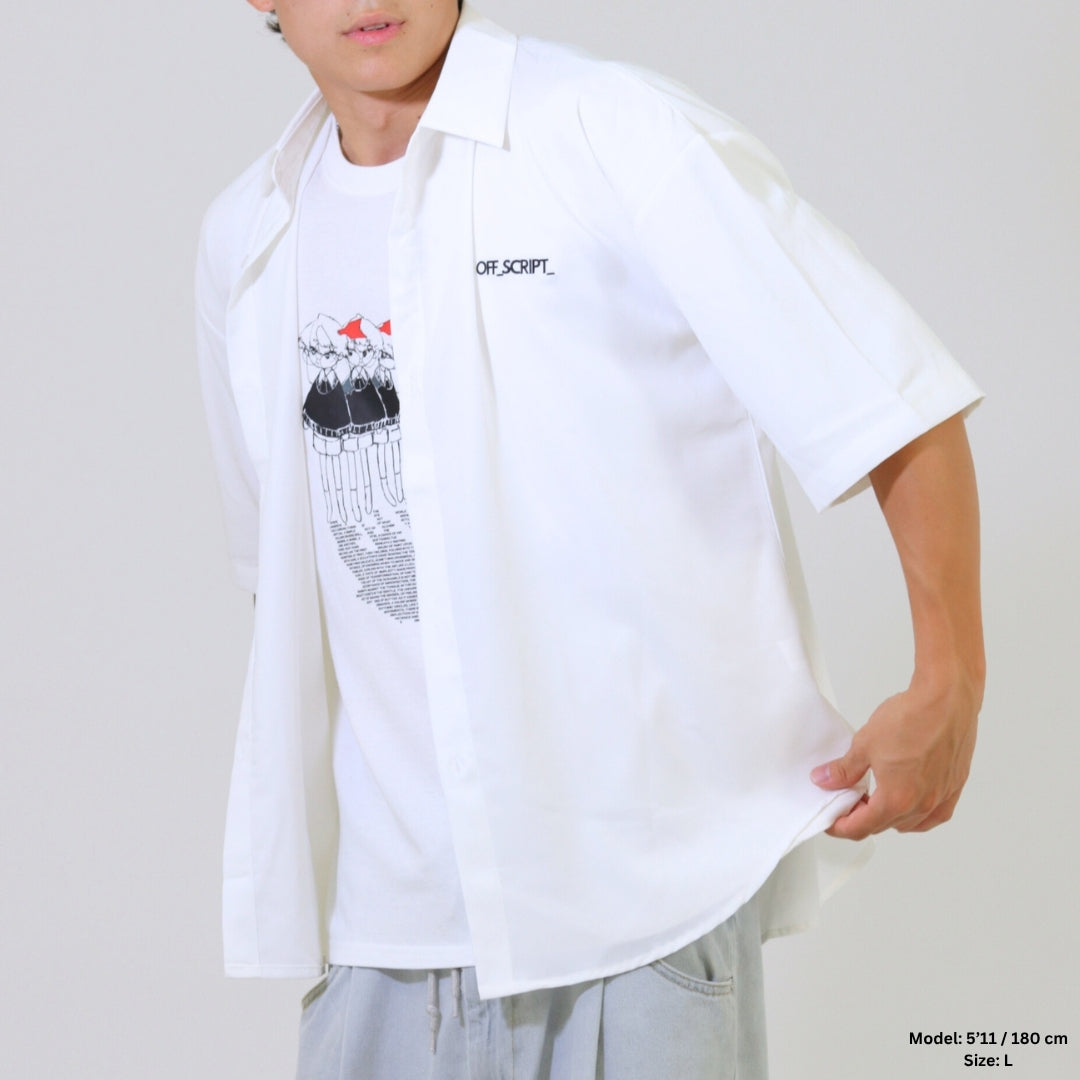 Person wearing a white oversized shirt with a graphic design on a plain background