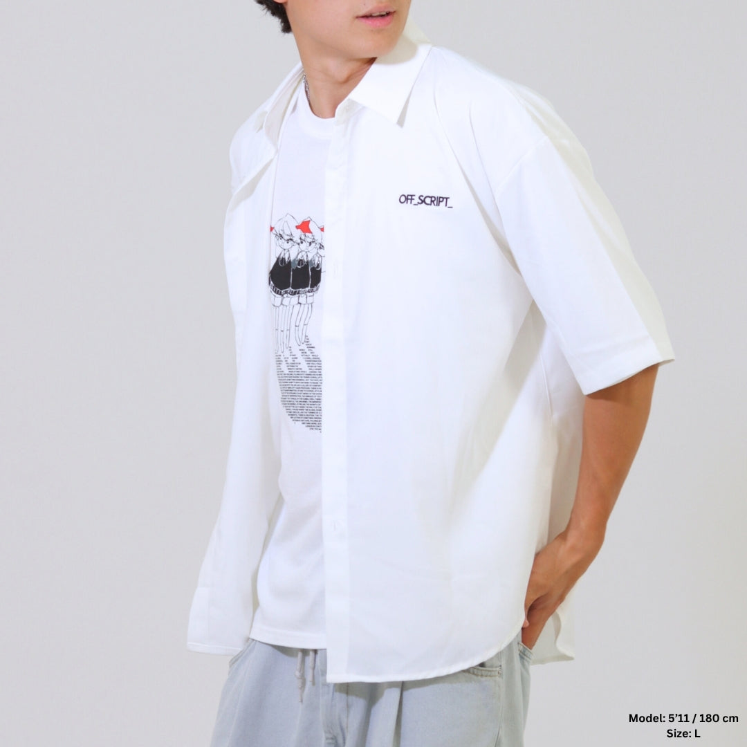 Person wearing a white shirt with graphic design and text on a plain background