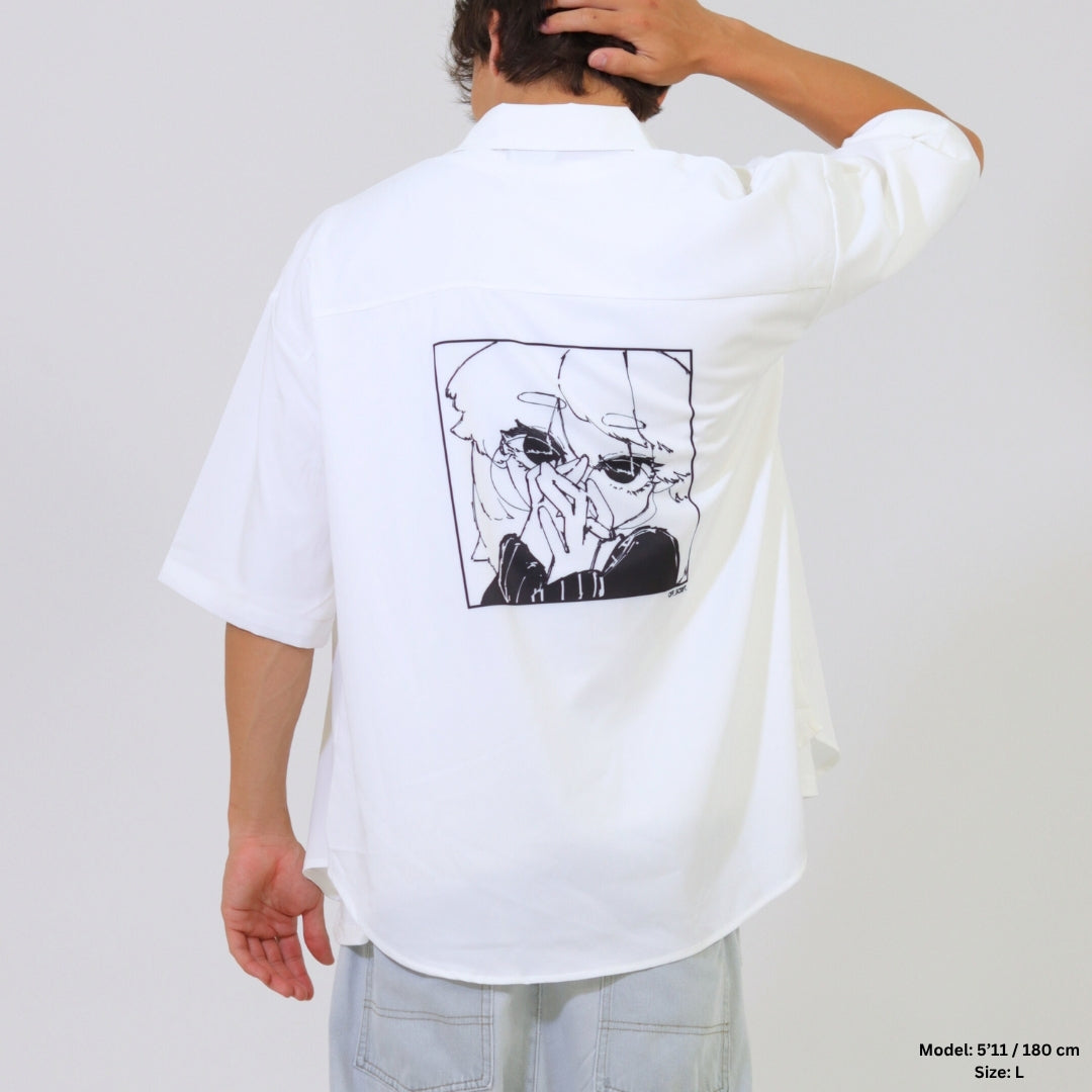 Person wearing a white shirt with a graphic design on the back against a plain background