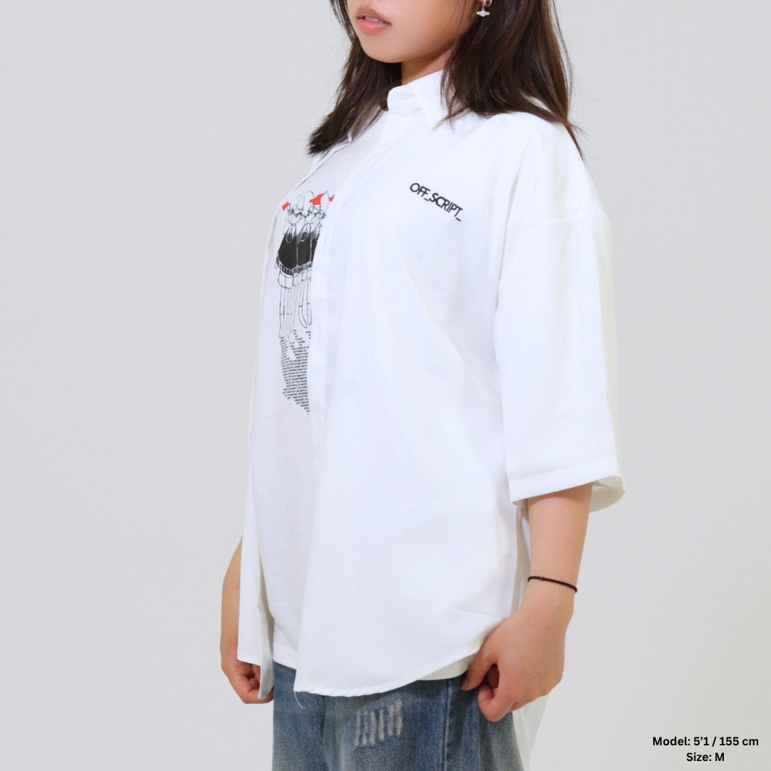 Person wearing a white oversized shirt with a graphic design on a plain background